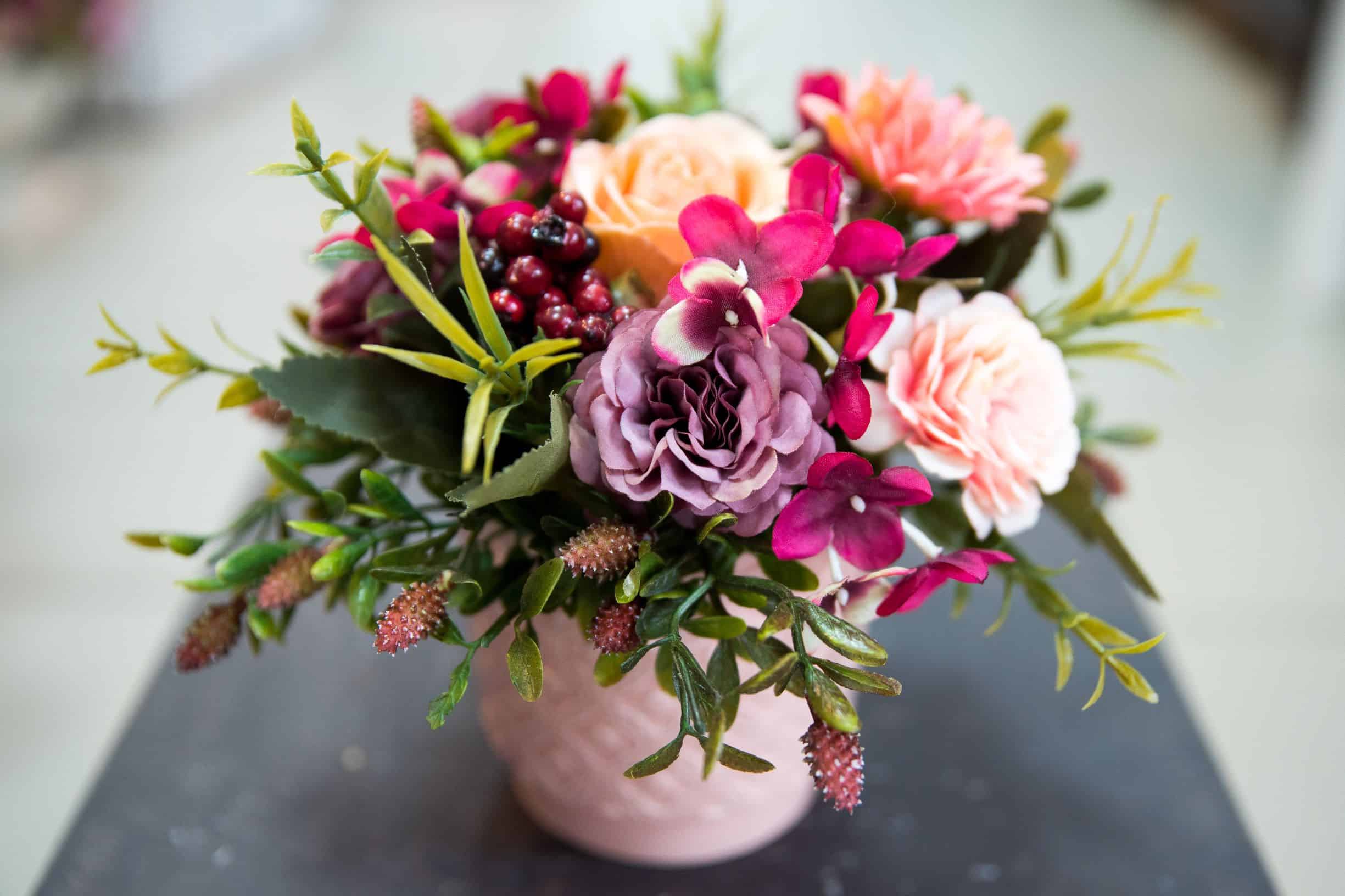 peach violet and pink assorted flowers in vase