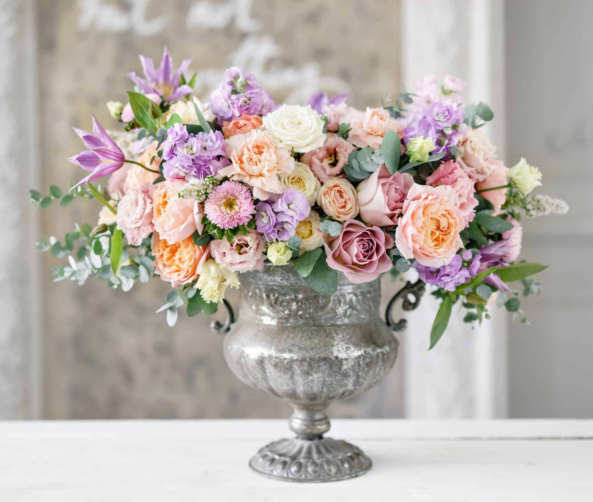 Image of Hydrangea bouquet in vase, flowers arranged in cascading pattern