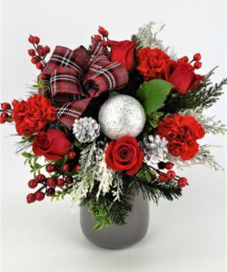 Create a new happy memory for the winter season! Roses, carnation and seasonal textures designed in a glass vase filled with red, silver, and grey accents. 