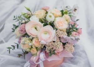 Bridal bouquet with ranunculus in peach, cream, lavender and assorted greenery