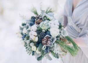 Winter bridal bouquet wth white, muted blues, and greens