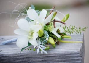 Ladies Floral Corsage of White Dendrobium Orchids and Decorative Materials. Wedding Flowers.