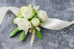 Florist at work: How to make wrist corsage for bride using rose and eustoma flowers. Secrets of making floral jewelry. Step by step, tutorial.
