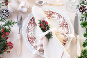 Welcoming and inviting place setting with winter berries