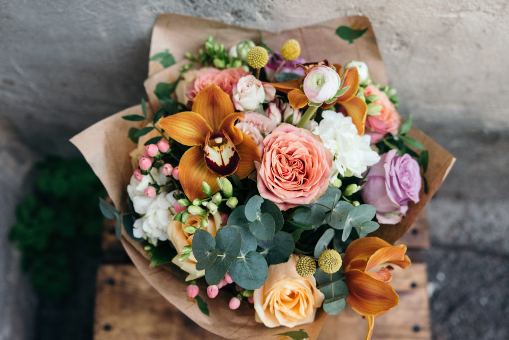 Colorful bouquet of orange, pink, green, white and more flowers