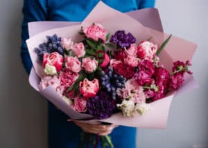 Multi colored bouquet with pink, red, purple, blue, green, and magenta