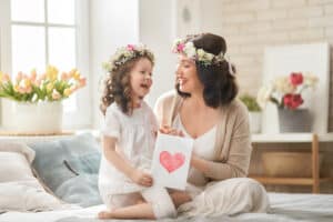 Mom and daughter wearing flower crowns