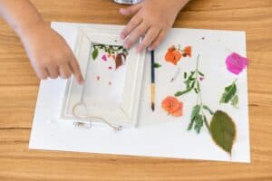 Child making pressed flower art