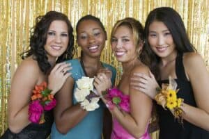 Friends at bridal shower wearing corsages