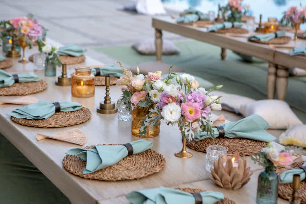 Table set for garden party with flowers