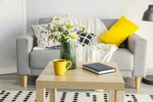 Daisies and chamomile arrangement in black and yellow living room