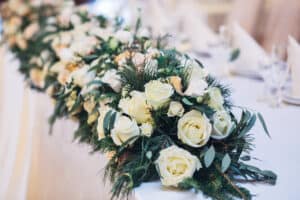 Garland of white roses and green pine