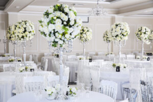 Dramatic white floral centerpieces on candelabras