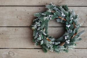 Wintry holiday wreath on wood