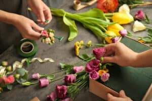 Women's hands making flower creations