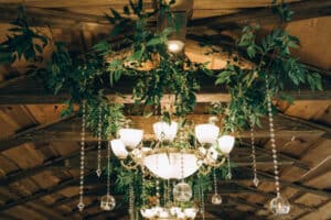 Chandelier decorated with greenery