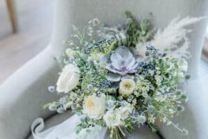 Blue, green, and white winter flowers 