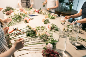 Group of people in floral design workshop