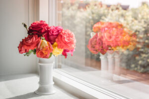 Bouquet of roses by window