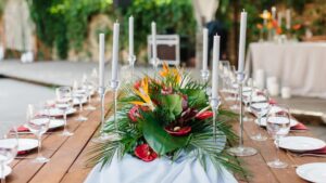 Tropical centerpiece on wooden wedding table
