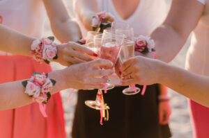 Bridal party wearing corsages and toasting