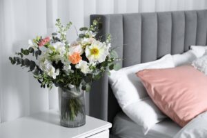 Vase of flowers in bedroom