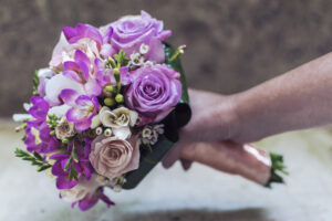 Purple wedding bouquet with accent blooms