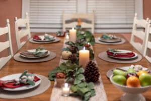 Understated centerpiece decor of greenery and pinecones