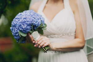 Bride holding bouquet of hydrangeas