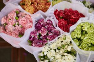 Clusters of carnations in wrapped individual colors