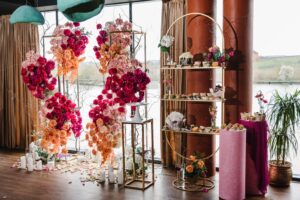 Sculptural carnation arrangements by dessert table