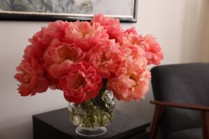 Vase of peonies in bloom in waiting room