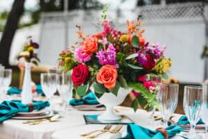Bold floral centerpiece with blue linens