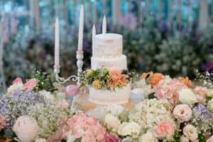 Wedding cake surrounded by flowers