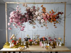 Floral cloud suspended over table with flowers