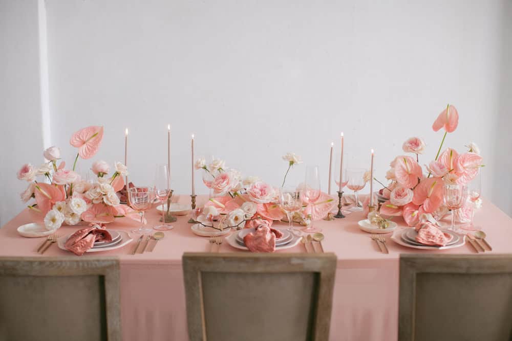 Sweetheart table with monochrome pink florals